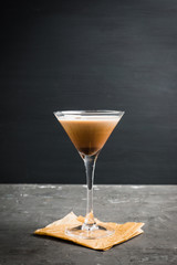 Chocolate martini with spices on the rustic background. Selective focus. Shallow depth of field.
