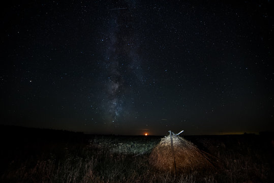 Haystack in the meadow and the Milky Way.
