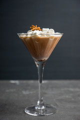Chocolate martini with spices and marshmallow on the rustic background. Selective focus. Shallow depth of field. 