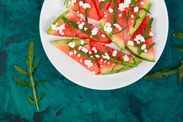 Fresh summer watermelon salad with feta cheese and arugula