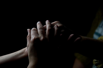 Fototapeta premium Young hands of a girl in the hands of an old grandmother