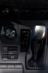 Fototapeta premium New car with automatic transmission at dealer showroom. Modern and prestigious vehicles.