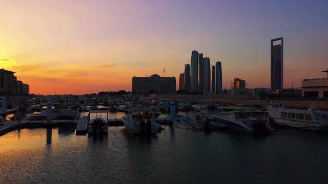 Beautiful view of Abu Dhabi city famous landscape, Etihad Towers, and Marina boats
