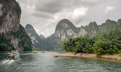 Cruise in the river Li between Guilin and Yangshuo. China. Landscape of Guilin, Li River and Karst mountains. - obrazy, fototapety, plakaty