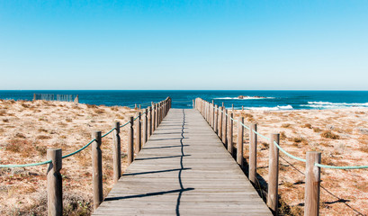 Wooden footpath at the beach. Portugal