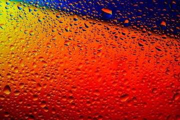 abstract waterdrops on the glass surfase with bright