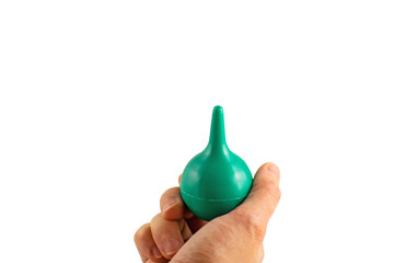 Woman holding the enema in hand. Woman hand hold syringe ball on white background