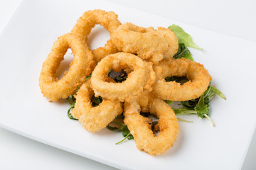 Fried battered or crumbed calamari rings