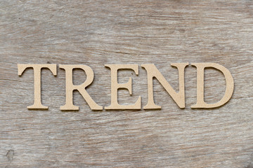 Alphabet letter in word trend on wood background