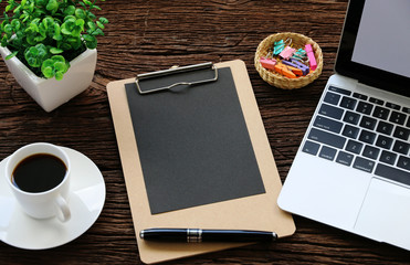 blank paper with Laptop,Coffee,cactus on the table copy space.