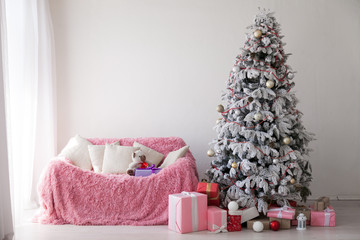 Fototapeta na wymiar White Christmas tree decorating Interior winter holiday gifts