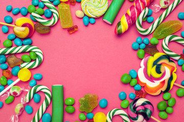Fototapeta na wymiar Frame of colorful bright assorted candy