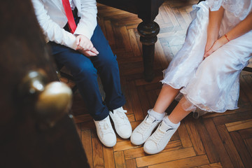 Bride and child with white sneakers