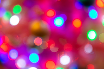 Bright bokeh on the background of Christmas trees and garlands background New Year 2019 year