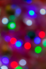 Bright bokeh on the background of Christmas trees and garlands background New Year 2019 year
