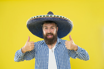 Maintain tradition. Mexican guy festive outfit ready to celebrate. Man bearded cheerful guy wear sombrero mexican hat yellow background. Mexican party concept. Celebrate traditional mexican holiday