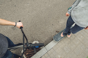 Obraz premium Young people with skateboard and bmx bike. Extreme urban sports concept