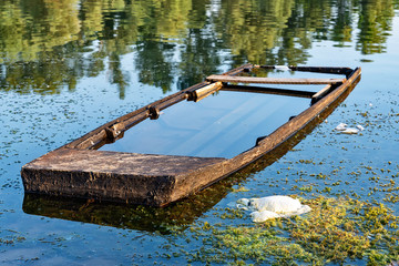 Naklejka premium Old abandoned and submerged boat
