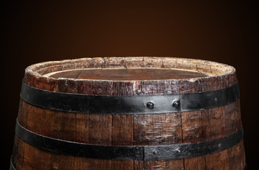 Old wooden barrel on a dark background