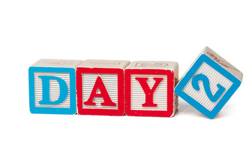 Colorful alphabet blocks. Word day isolated on white background