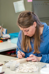Female Artist working on stones mosaic