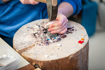 Hands Artist working on stones mosaic