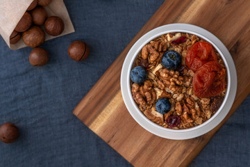 Healthy breakfast. Granola, walnut, macadamia nut and dried apricots.