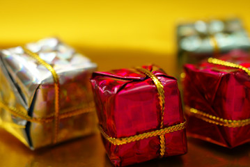 christmas presents on gold background