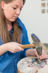 Female Artist working on stones mosaic