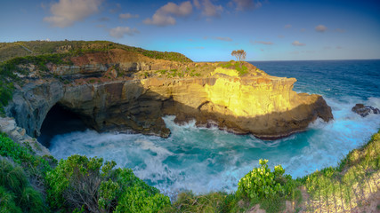 Summer evening light on the sea cave at Snapper Point in Frazer Park within the Munmorah State...