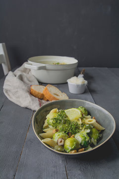 Pasta with brussels sprout, hazelnut, walnut and cress, limette soy sauce with parmesan and baguette