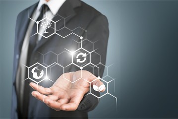 Businessman holding virtual reality concept