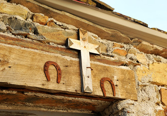 Popular superstition, house protected with a crucifix and two horseshoes in Las Hurdes, mountainous...