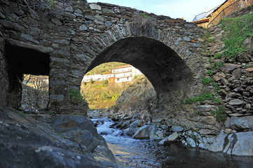 Medieval stone bridge over the river Hurdano in Casarrubia village. Las Hurdes is a mountanious region of the north of Caceres province, Extremadura, Spain