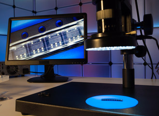 Laboratory of semiconductor chips. The development of modern electronics. crystal chip in the microscope