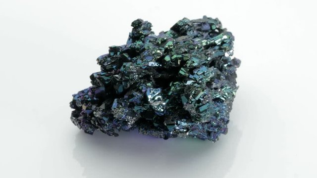 Silicon carbide (carborundum),  shiny and colorful mineral stone from Vesuvius volcano isolated on a white background, Naples, Italy
