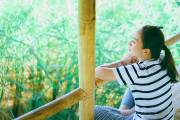 woman relax sit in the field with sunlight in countryside