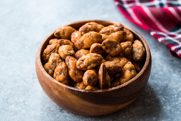 Almond Nuts with Barbeque Sauce in Wooden Bowl.