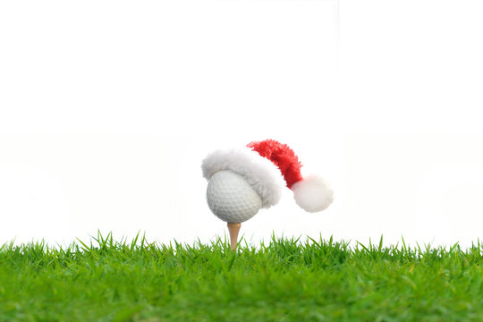 Festive-looking Golf Ball On Tee With Santa Claus' Hat On Top For Holiday Season Isolated On White Background