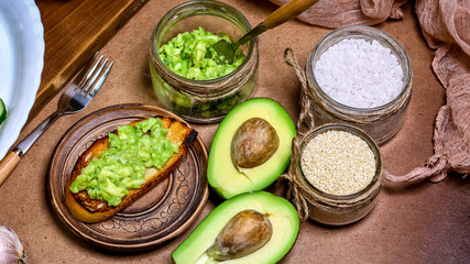 bruschetta with avocado, spices. Raw Organic breakfast Healthy eating. Dieting and weight loss...