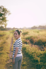 women standing a outdoor with sunset light in countryside for relaxing