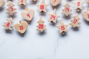 Festive Christmas advent calendar made from wooden shapes