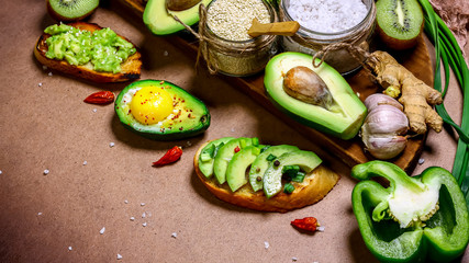 assortment of bruschetta with avocado. Authentic lifestyle image. copy space, top view