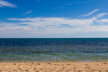 Fototapeta na wymiar seascape - blue sea and sandy beach