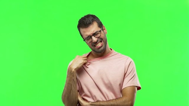 man with tired and sick expression  on green screen chroma key background