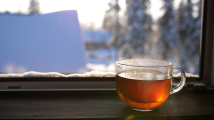 Winter frosty day. A Cup of hot tea in the morning.