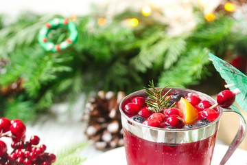 Christmas Cranberry cocktail drink on festive X-mas background