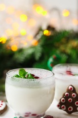 Coconut white Christmas Margarita /X-mas new year drink on festive bokeh background