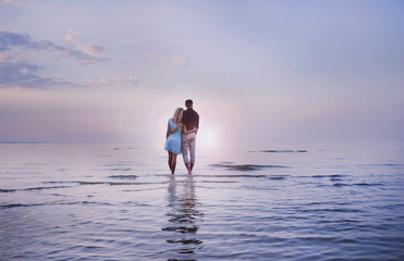 Fototapeta premium one young beautiful couple in love admire the sea view