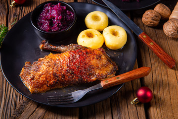 classic and crispy roasted duck with cabbage and dumplings